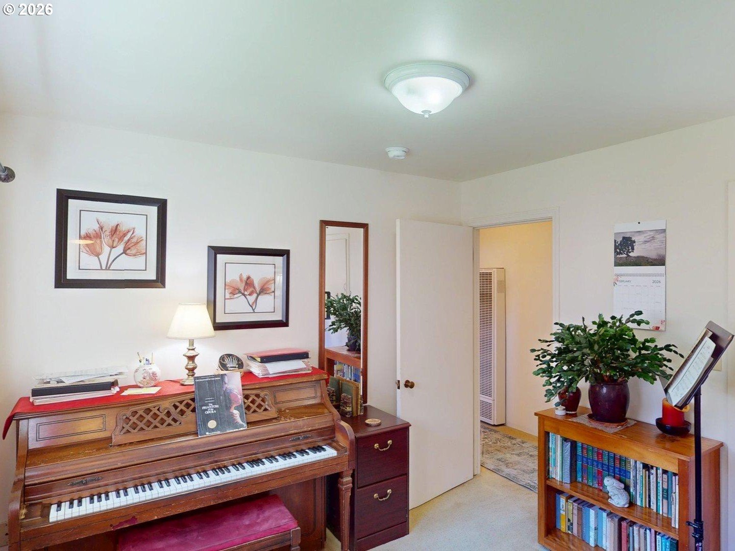99270 Winchuck River Road Brookings, OR 97415 - Photo 28 of 40 a living room with furniture and a bookshelf