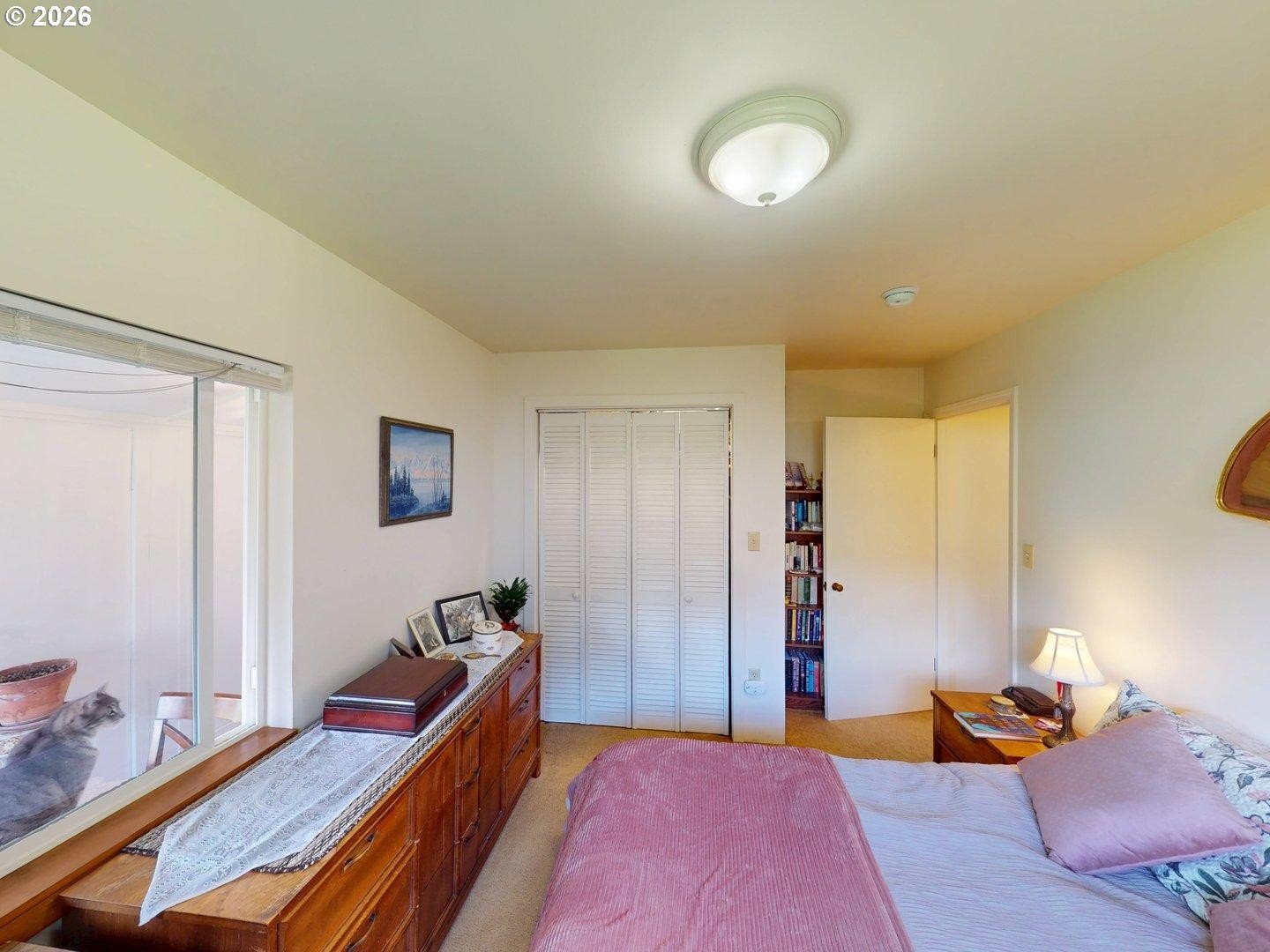 99270 Winchuck River Road Brookings, OR 97415 - Photo 32 of 40 a bed room with a bed and a lamp