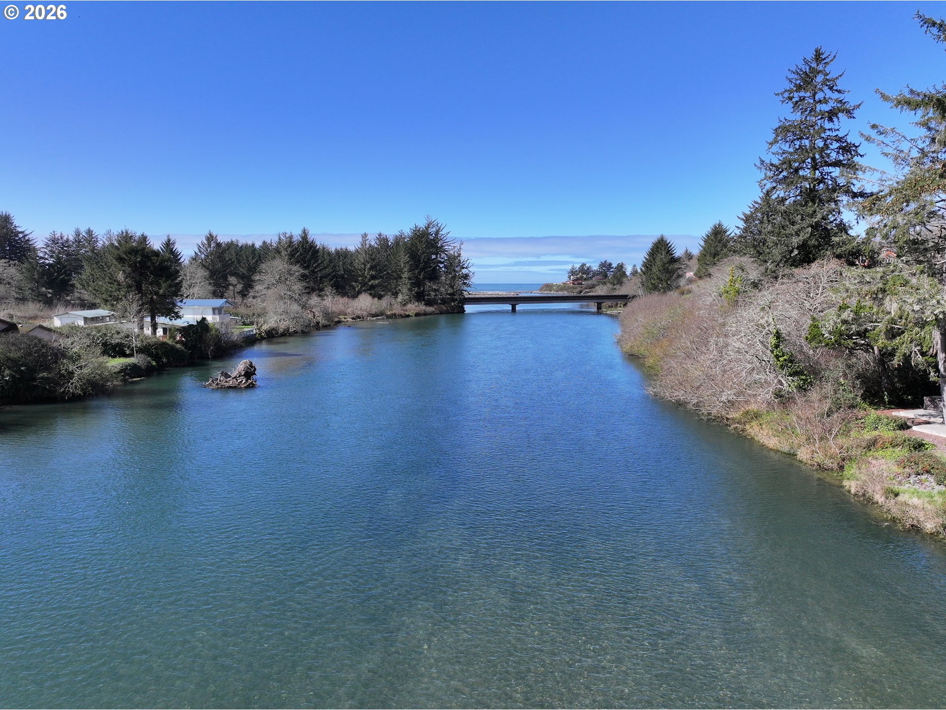 99270 Winchuck River Road Brookings, OR 97415 - Photo 8 of 40 a view of a lake with houses