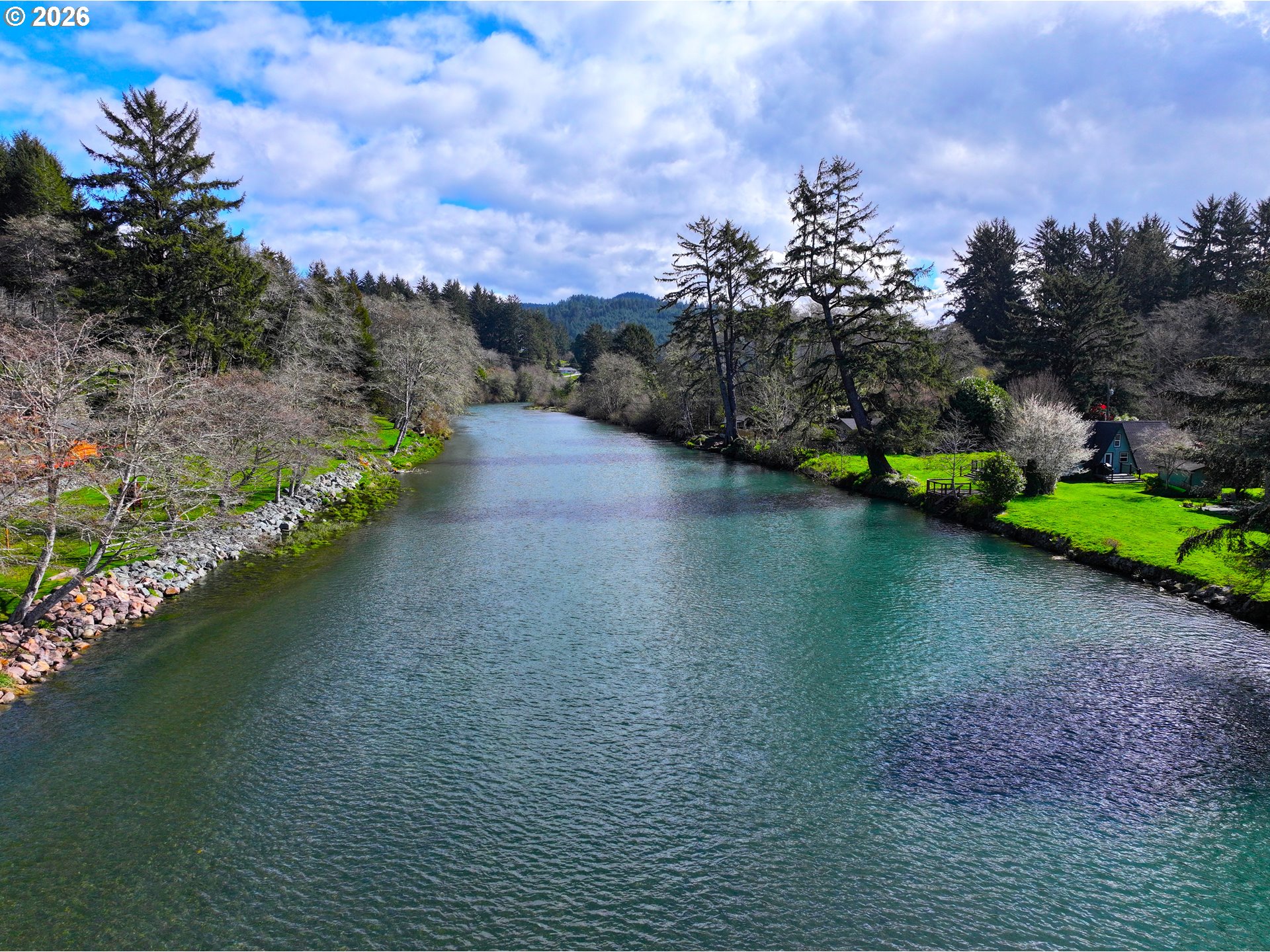 99270 Winchuck River Road Brookings, OR 97415 - Photo 9 of 40 a view of a lake with houses in back