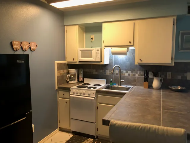 a kitchen with a stove and a microwave