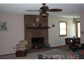 378 Hooker Road Tryon, NC 28782 - Photo 5 of 11 a living room with furniture and a fireplace