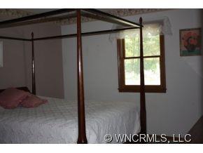 378 Hooker Road Tryon, NC 28782 - Photo 10 of 11 a balcony with window and wall