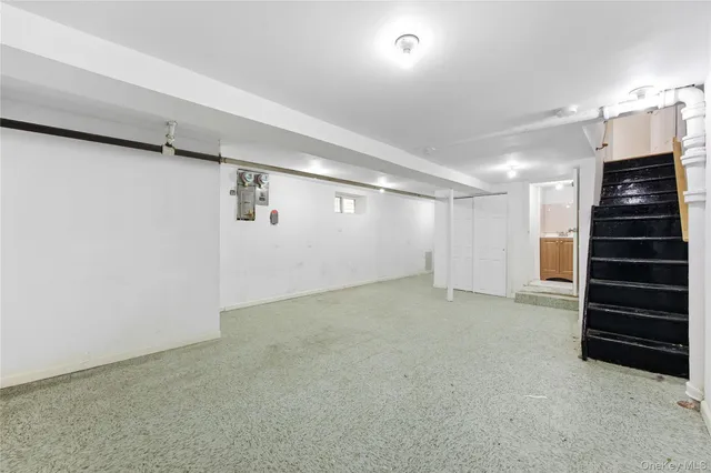 a view of an empty room with a fireplace