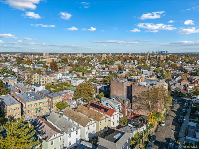 a front view of multi story residential apartment building with yard