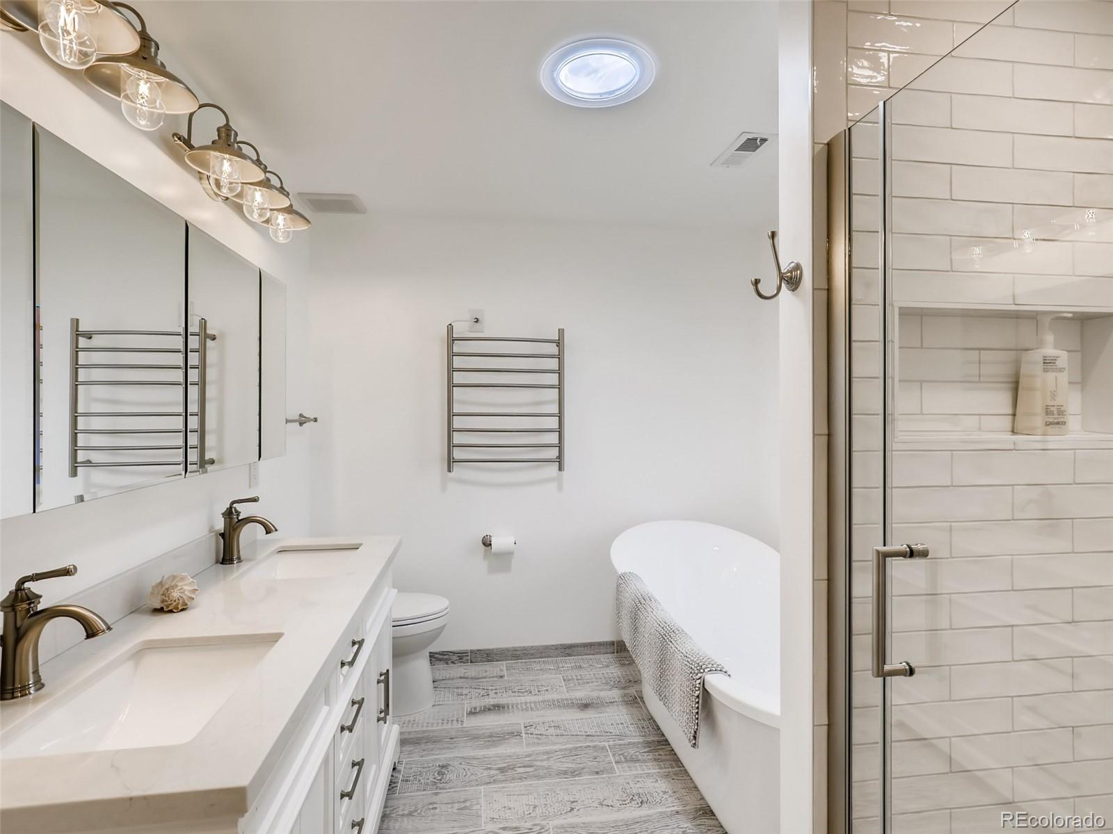 900 Cherryvale Road Boulder, CO 80303 - Photo 13 of 30 a spacious bathroom with a tub sink and mirror
