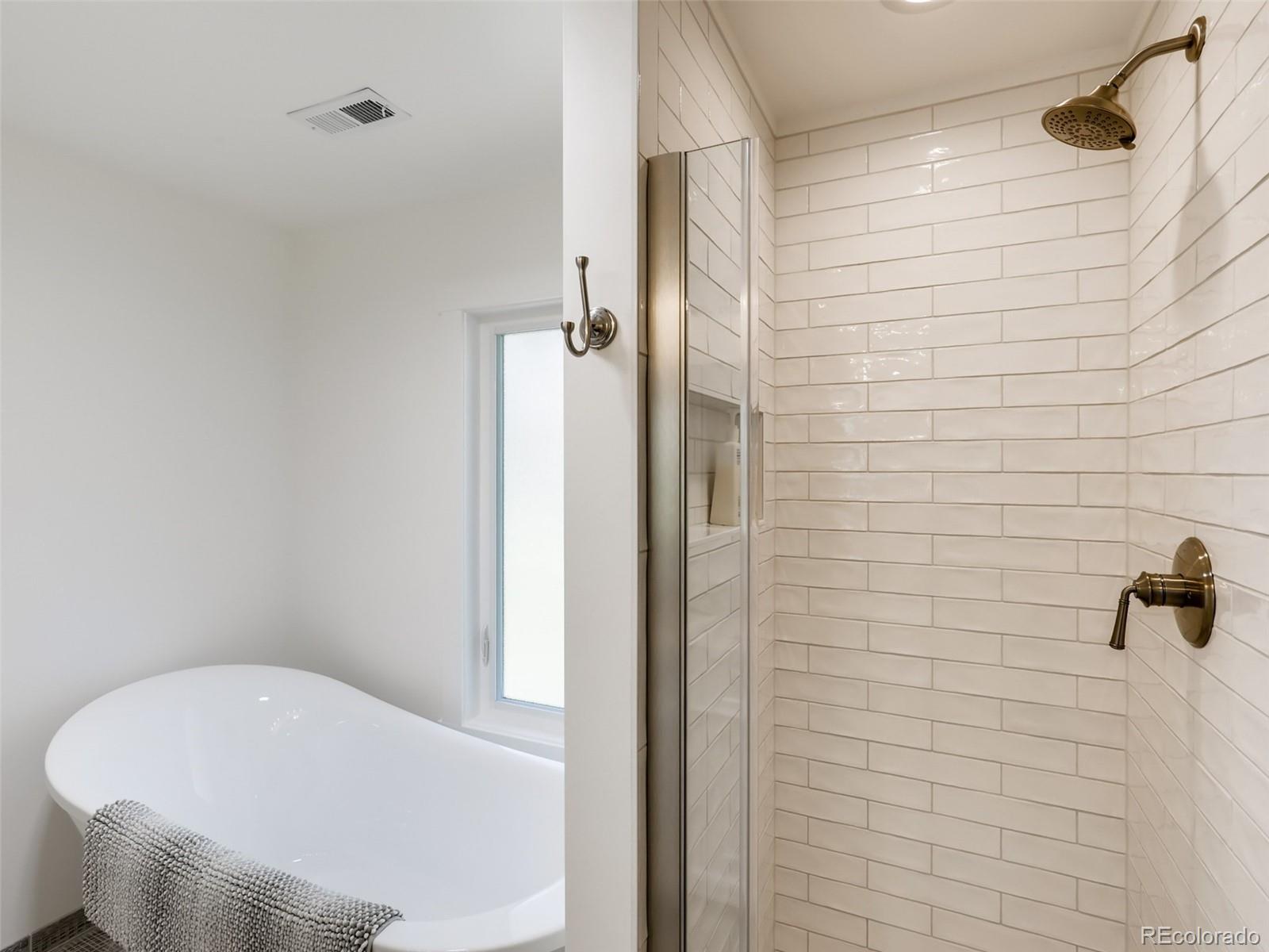 900 Cherryvale Road Boulder, CO 80303 - Photo 14 of 30 a bathroom with a white tub and shower