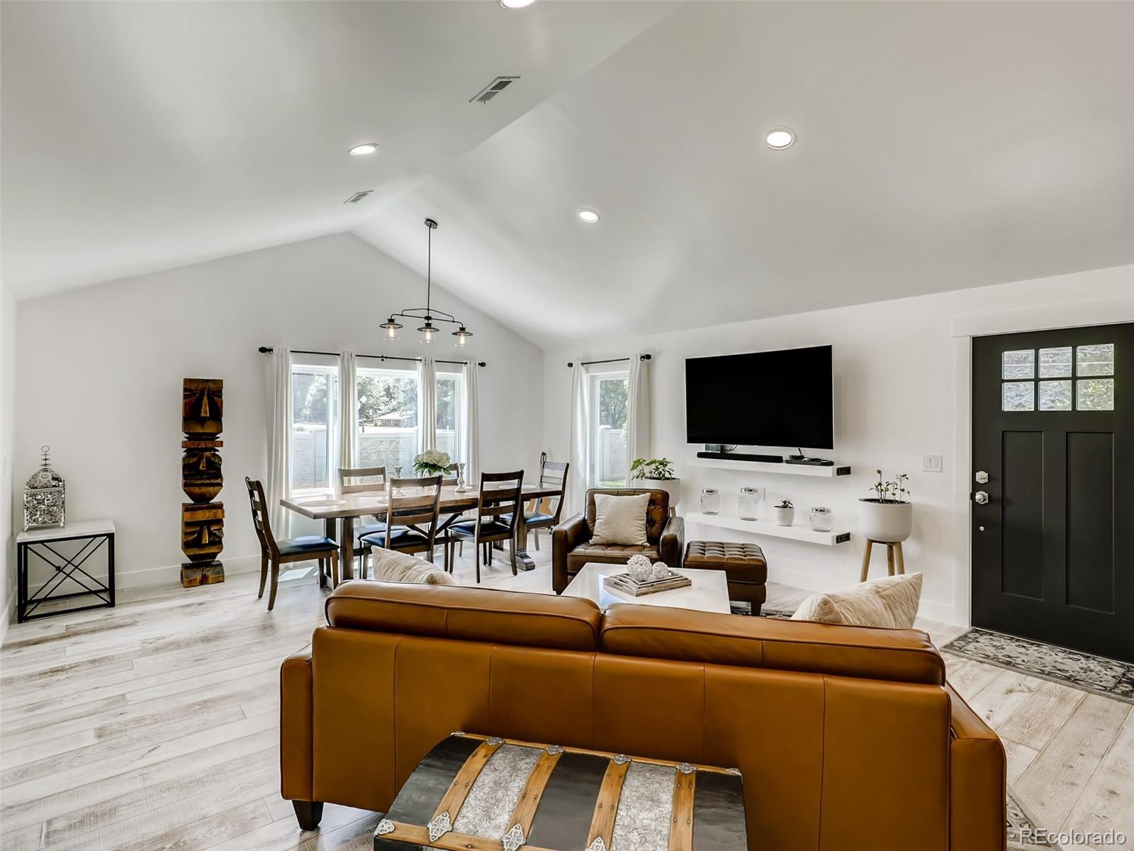 900 Cherryvale Road Boulder, CO 80303 - Photo 4 of 30 a living room with furniture and a flat screen tv