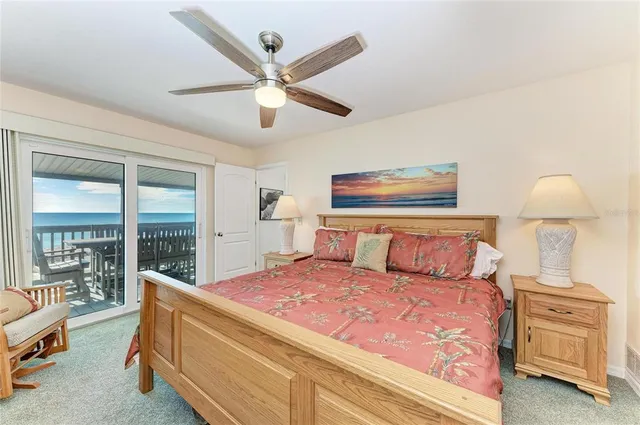 a bedroom with a large bed and a large mirror