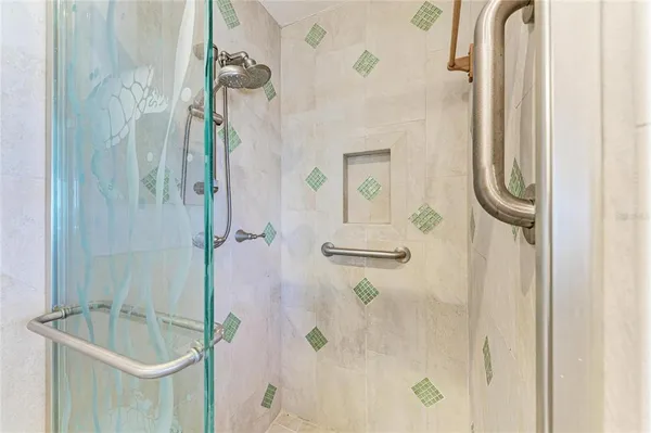 a bedroom with two large bed and a large window