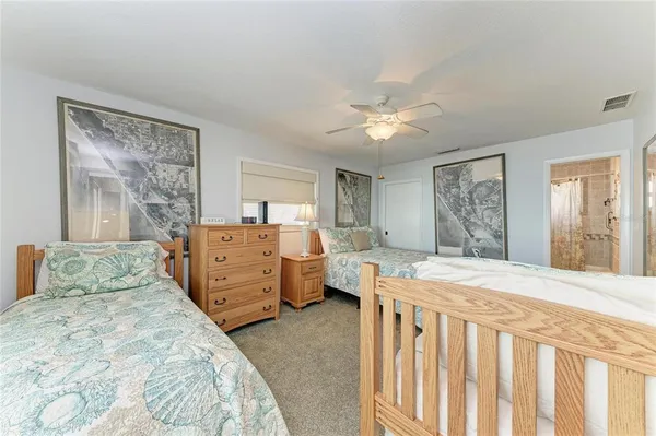 a bathroom with a sink a toilet and shower curtain