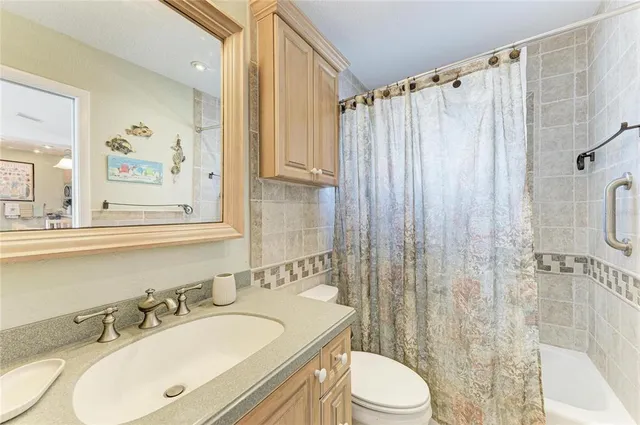 a utility room with dryer washer and a window