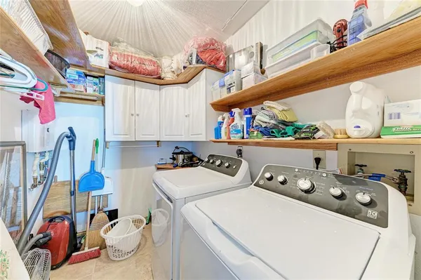 a balcony with a table and chairs