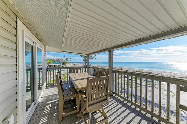 a view of a balcony with furniture