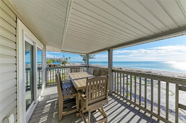 a view of a balcony with furniture