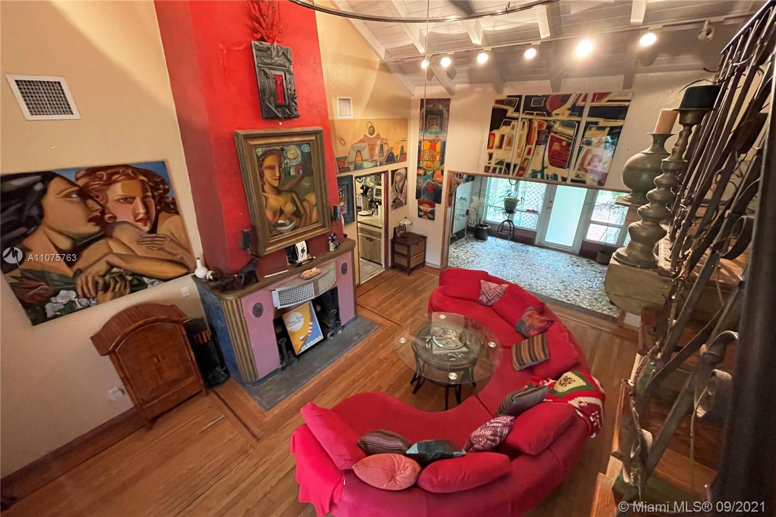 435 Northeast 77th Street Road Miami, FL 33138 - Photo 11 of 14 a living room with furniture and a fireplace