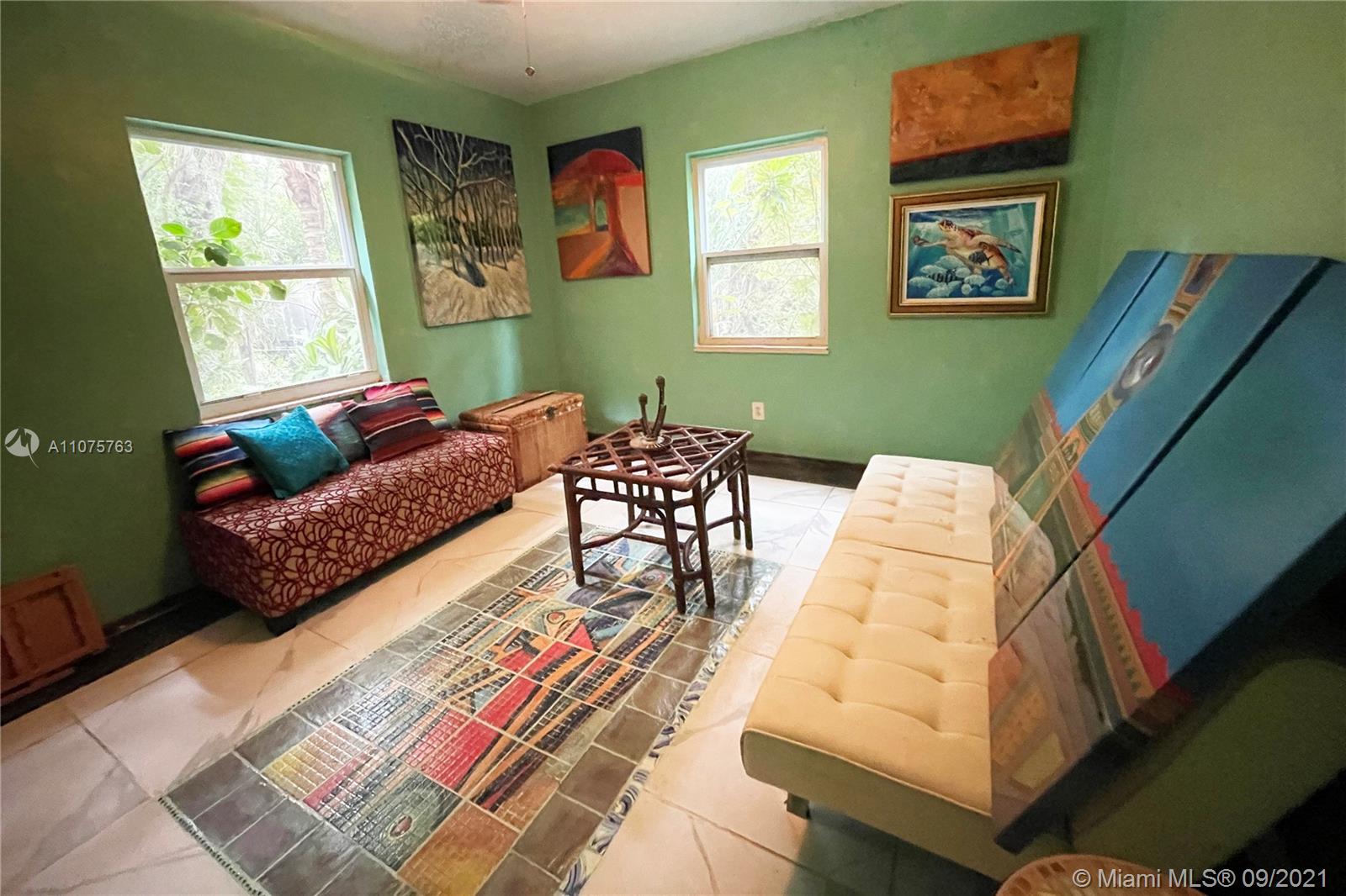 435 Northeast 77th Street Road Miami, FL 33138 - Photo 13 of 14 a living room with furniture and a window