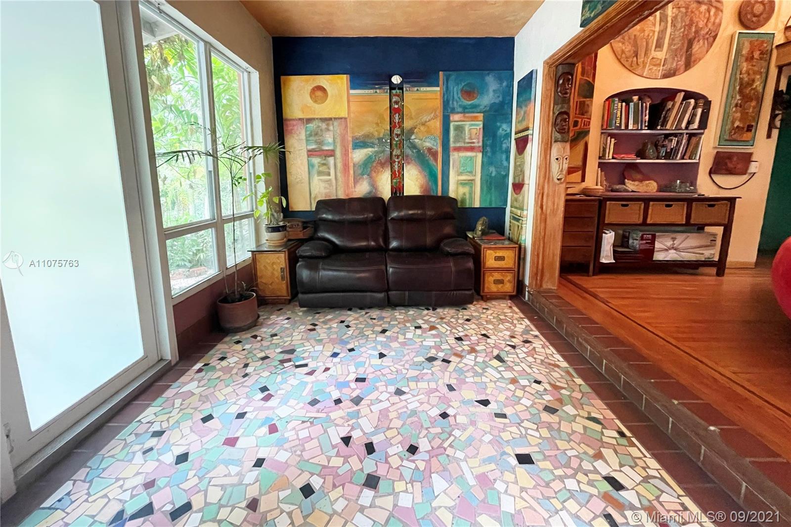 435 Northeast 77th Street Road Miami, FL 33138 - Photo 14 of 14 a bedroom with a bed and wooden floor