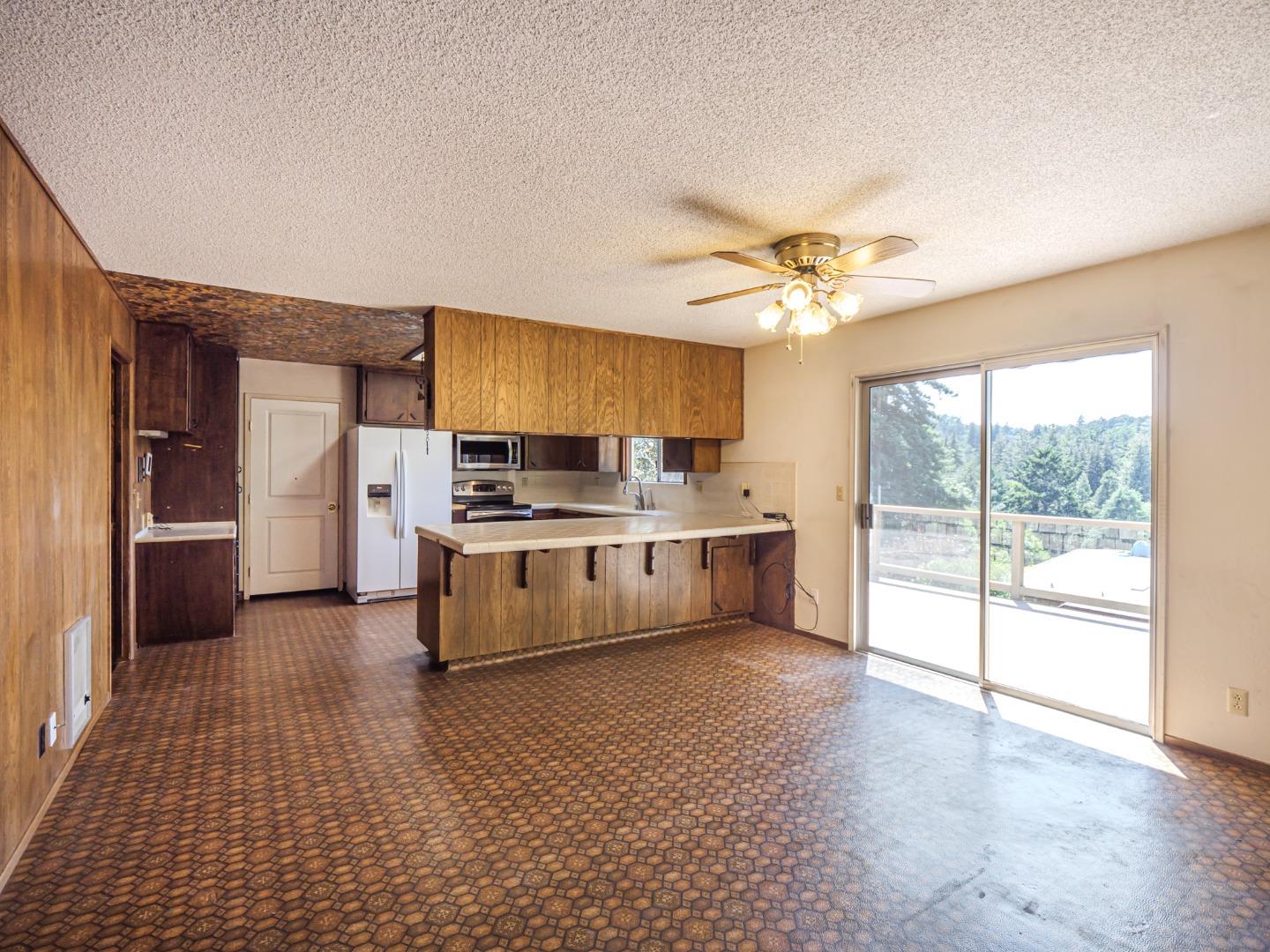 135 McKay Road Aptos, CA 95003 - Photo 15 of 57 a large kitchen with stainless steel appliances a stove a refrigerator and a sink
