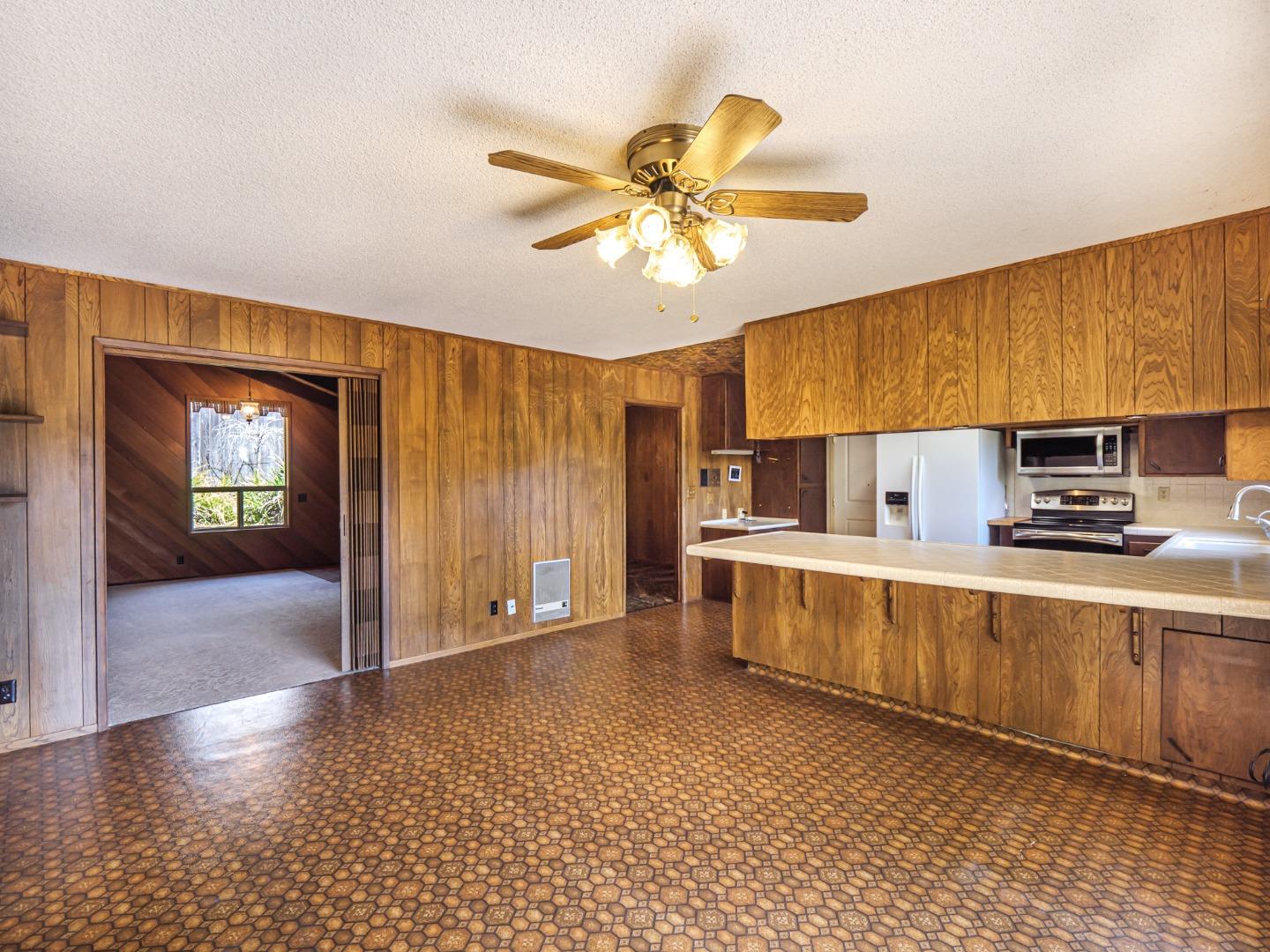 135 McKay Road Aptos, CA 95003 - Photo 16 of 57 a kitchen with stainless steel appliances a sink cabinets and wooden floor