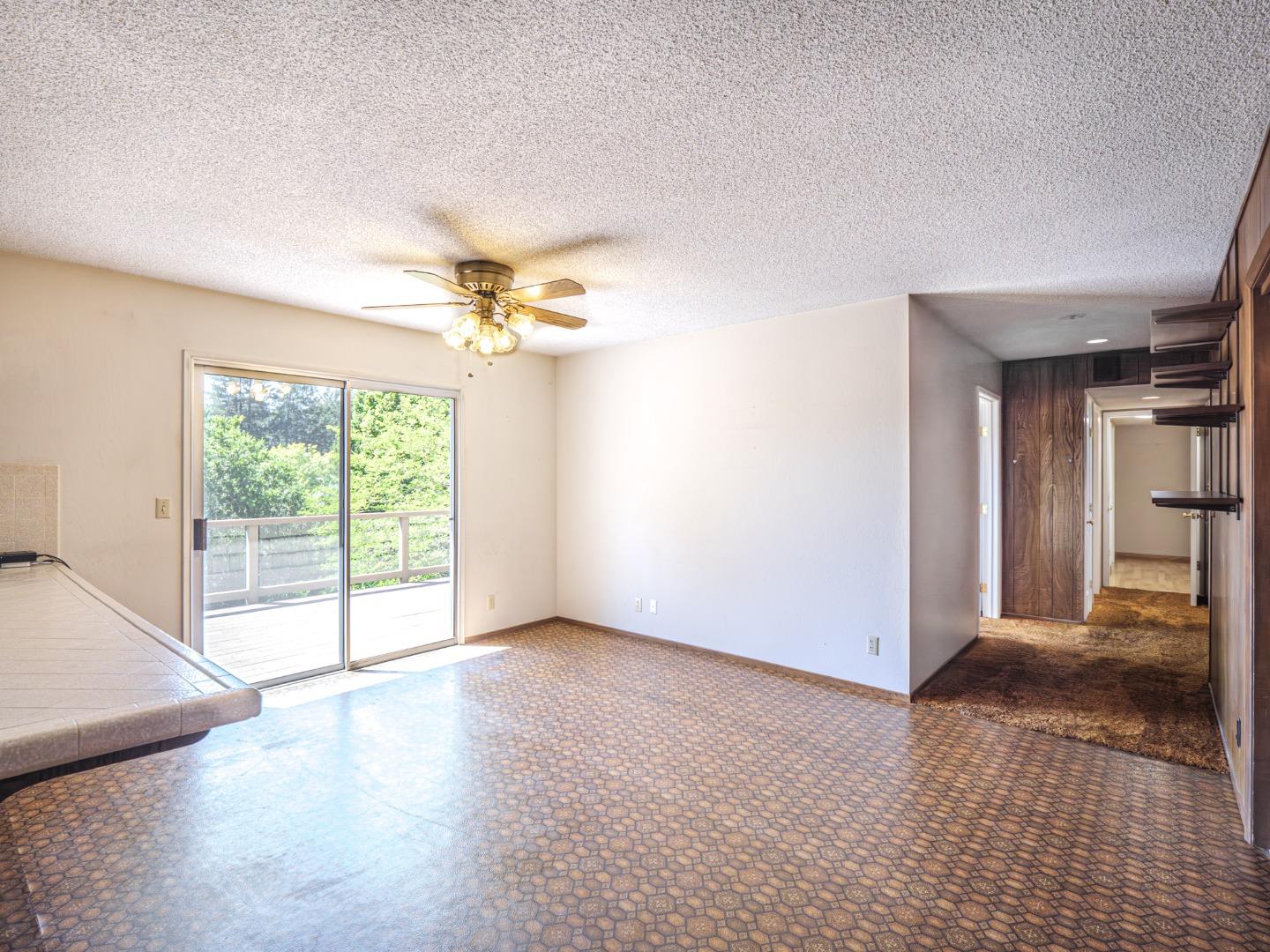 135 McKay Road Aptos, CA 95003 - Photo 17 of 57 a view of a livingroom with a ceiling fan and window