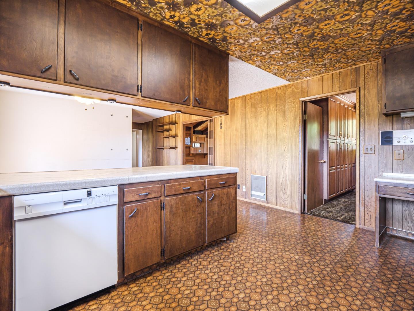 135 McKay Road Aptos, CA 95003 - Photo 22 of 57 a kitchen with stainless steel appliances granite countertop a sink a stove a refrigerator and cabinets