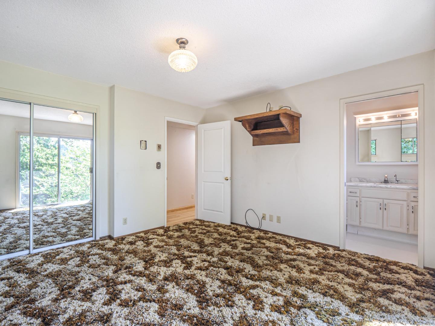 135 McKay Road Aptos, CA 95003 - Photo 26 of 57 a view of a bedroom with wooden floor and window