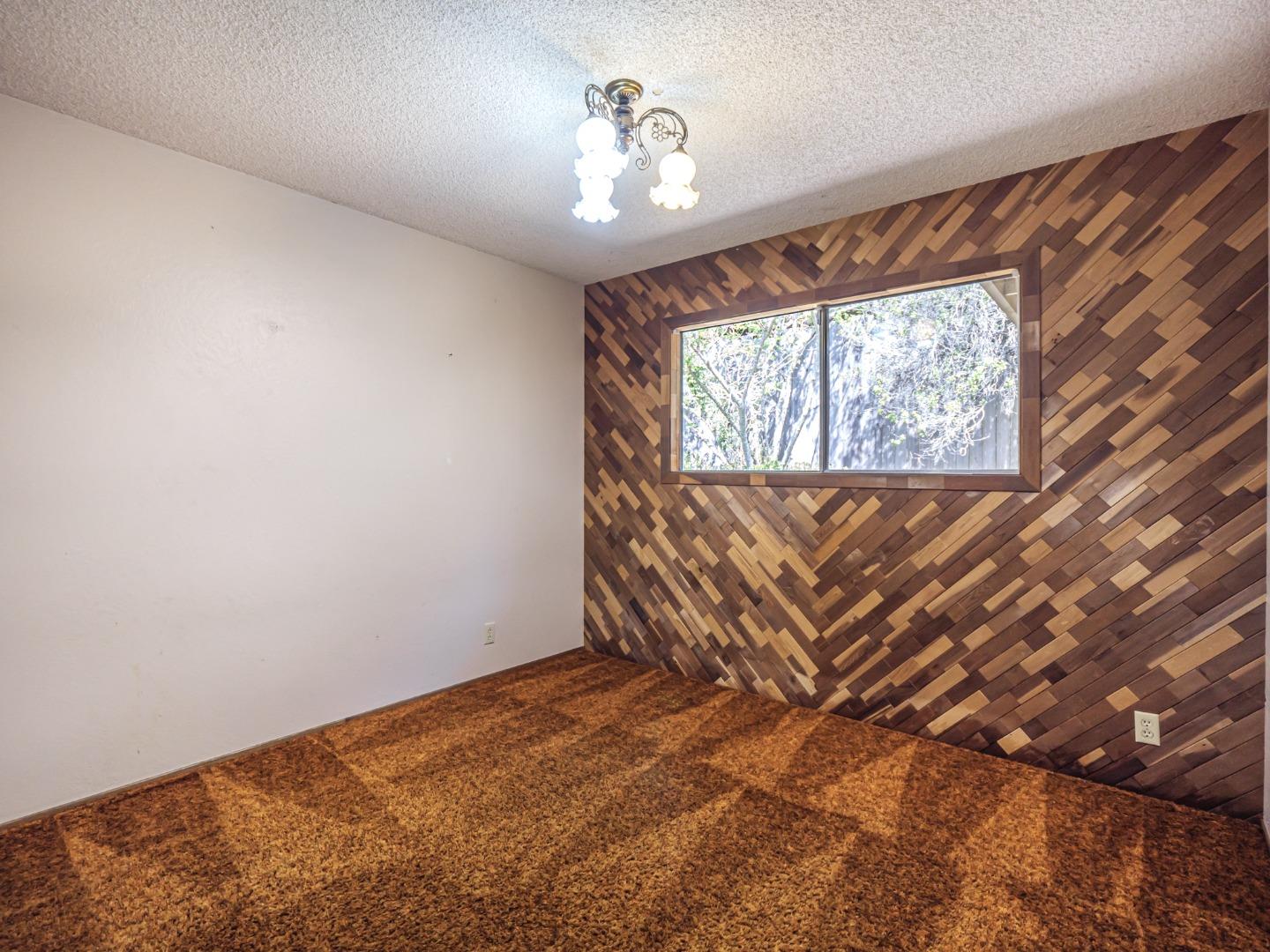 135 McKay Road Aptos, CA 95003 - Photo 28 of 57 a view of an empty room with windows