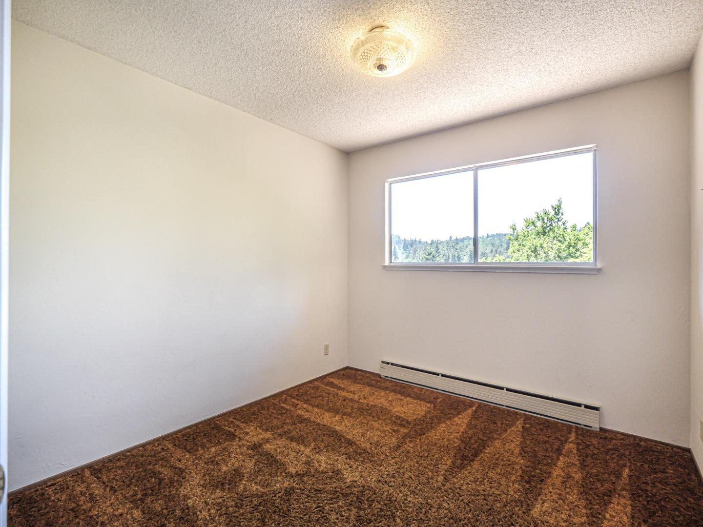 135 McKay Road Aptos, CA 95003 - Photo 29 of 57 an empty room with a window
