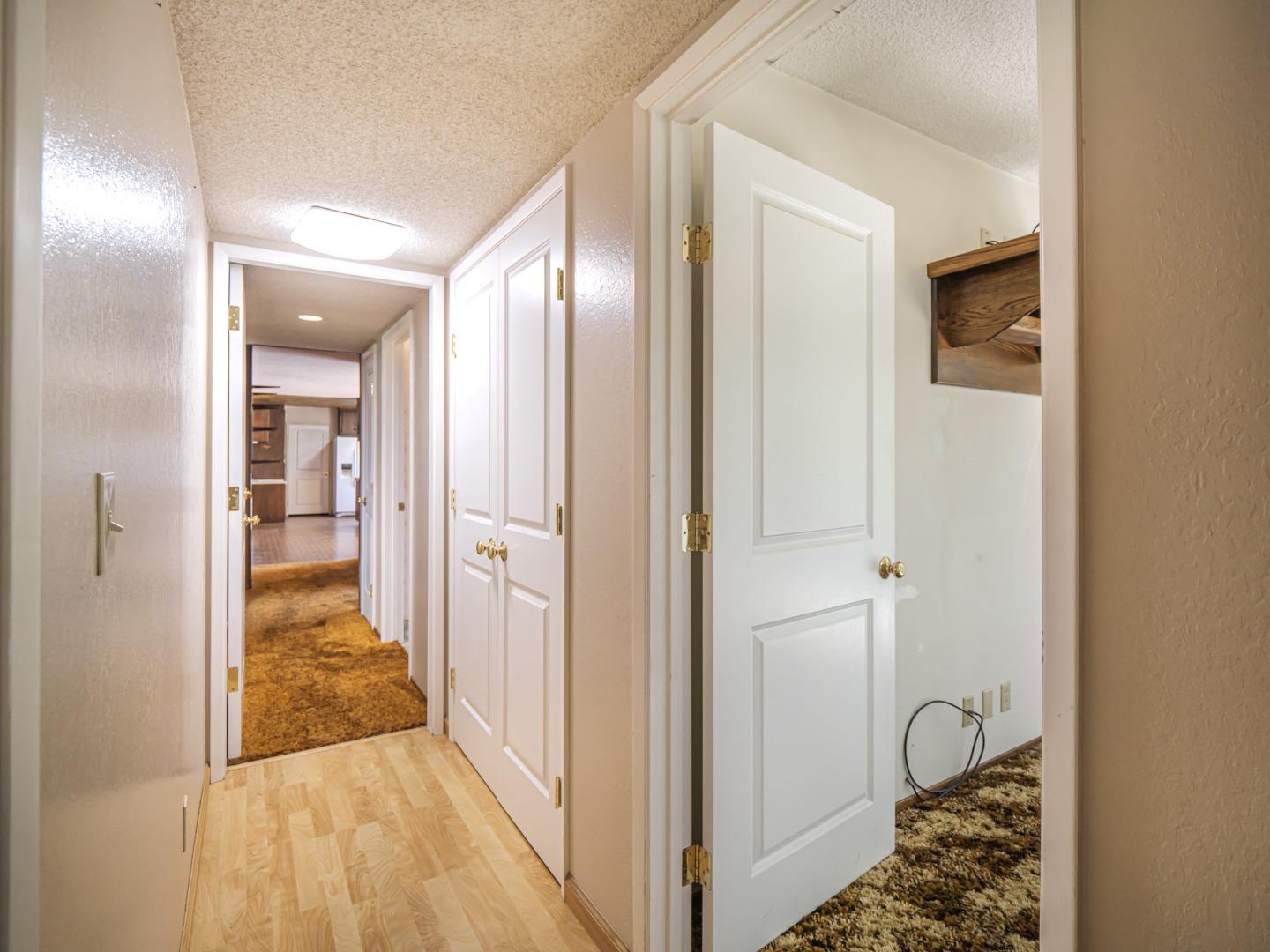 135 McKay Road Aptos, CA 95003 - Photo 34 of 57 a view of a hallway with wooden floor and a bathroom