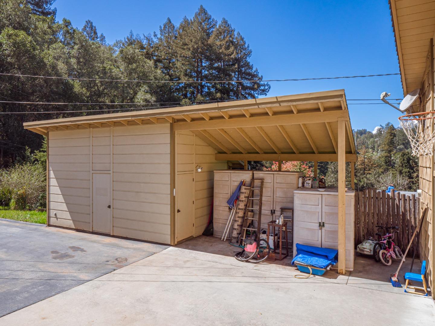 135 McKay Road Aptos, CA 95003 - Photo 48 of 57 a view of a garage with wooden wall and roof