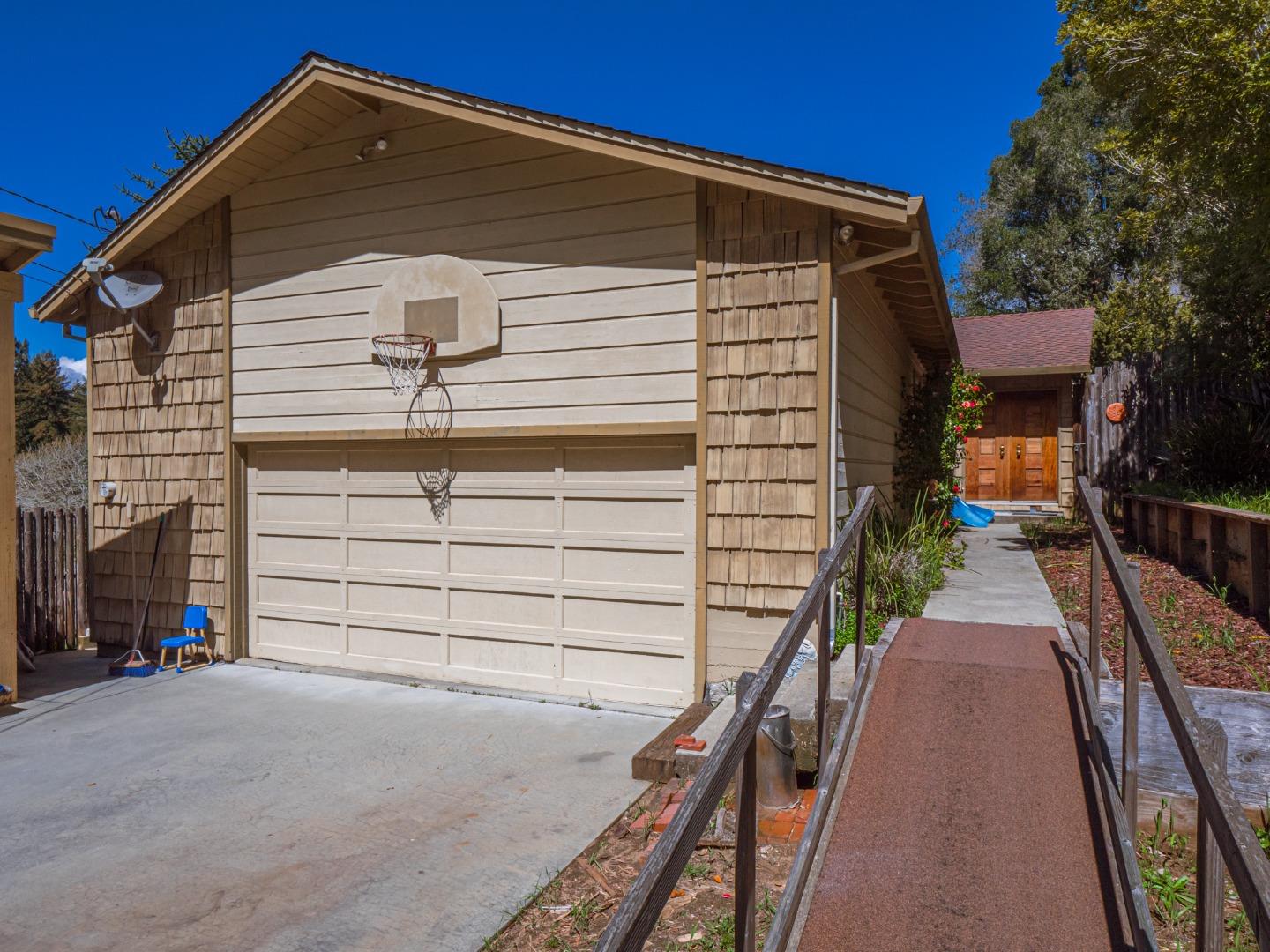 135 McKay Road Aptos, CA 95003 - Photo 6 of 57 a front view of a house with a yard