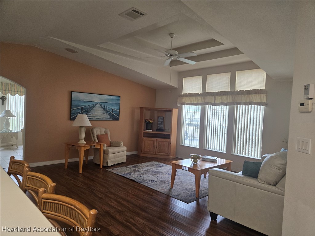 3312 Beartooth Pass Sebring, FL 33872 - Photo 6 of 39 a living room with furniture and a large window