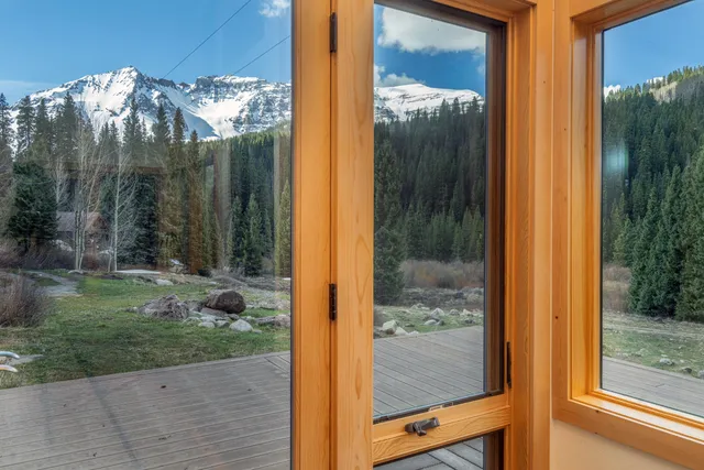 a view of a glass door and a yard