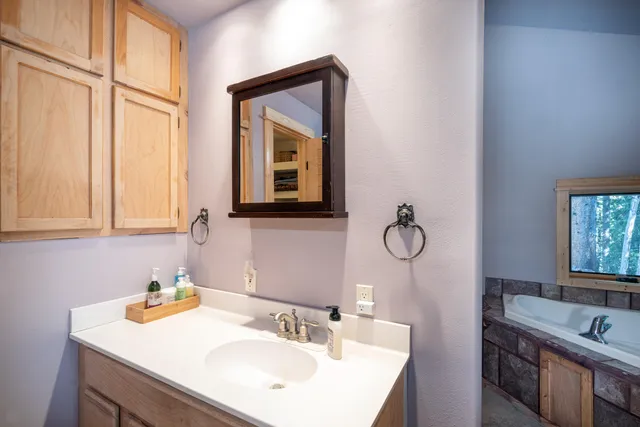 a view of a patio with a table and chairs