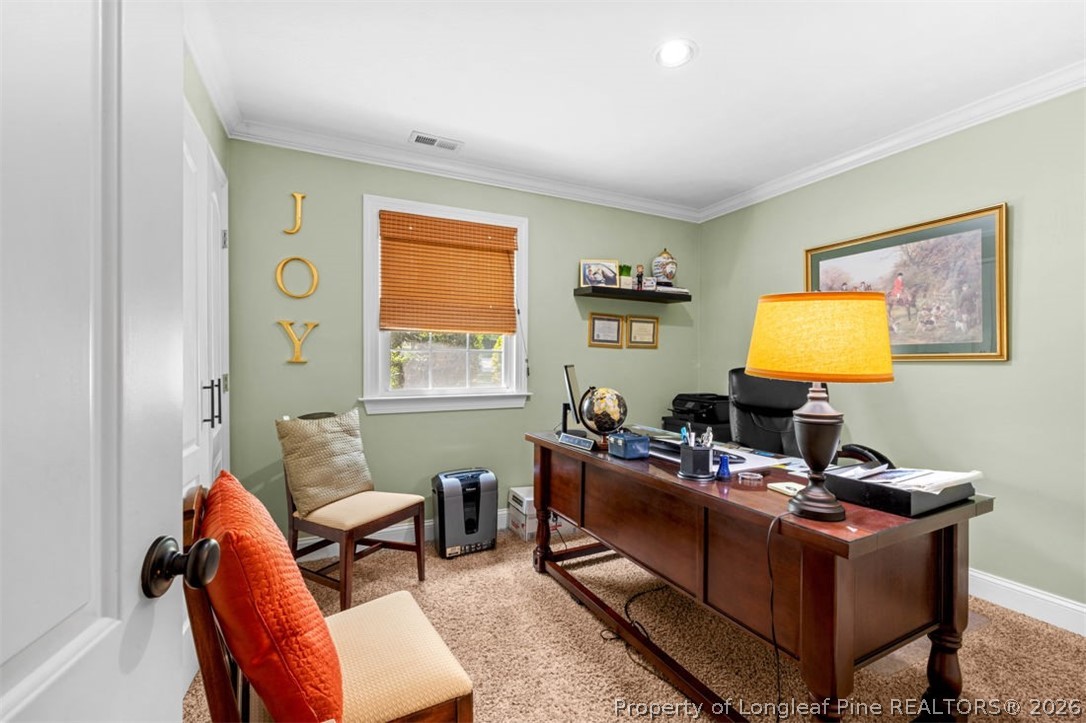 310 Canady Street Fayetteville, NC 28306 - Photo 13 of 50 a living room with furniture and a window