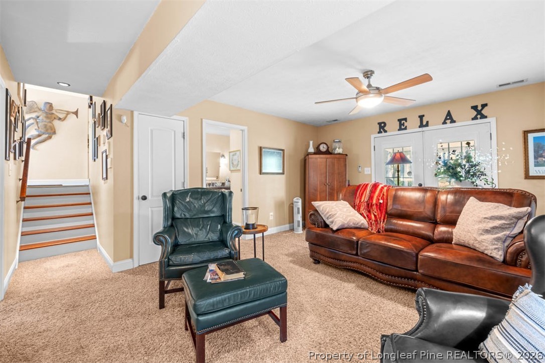 310 Canady Street Fayetteville, NC 28306 - Photo 15 of 50 a living room with furniture and a wooden floor