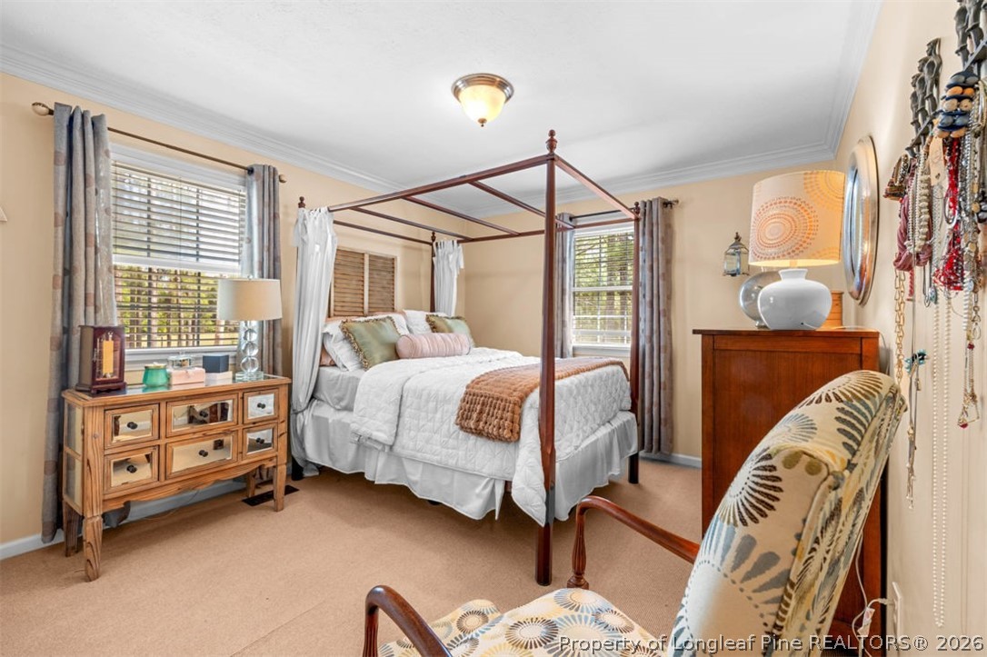 310 Canady Street Fayetteville, NC 28306 - Photo 21 of 50 a bedroom with a bed and a window