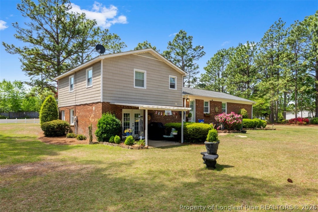 310 Canady Street Fayetteville, NC 28306 - Photo 23 of 50 a view of a house with a yard and tree s