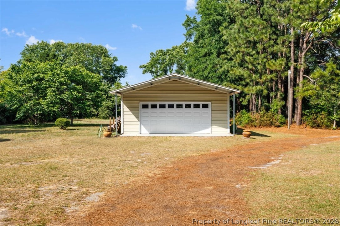 310 Canady Street Fayetteville, NC 28306 - Photo 25 of 50 a house with a yard
