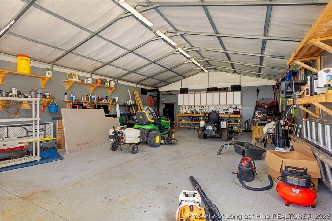 310 Canady Street Fayetteville, NC 28306 - Photo 26 of 50 a view of a garage with a car and parked yellow