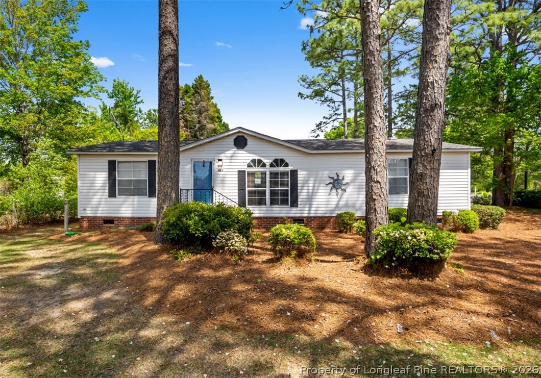 310 Canady Street Fayetteville, NC 28306 - Photo 27 of 50 a front view of a house with garden