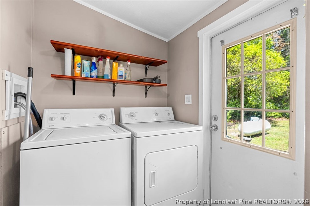 310 Canady Street Fayetteville, NC 28306 - Photo 36 of 50 a utility room with dryer and washer