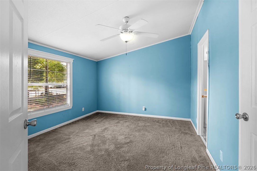 310 Canady Street Fayetteville, NC 28306 - Photo 37 of 50 an empty room with windows and closet