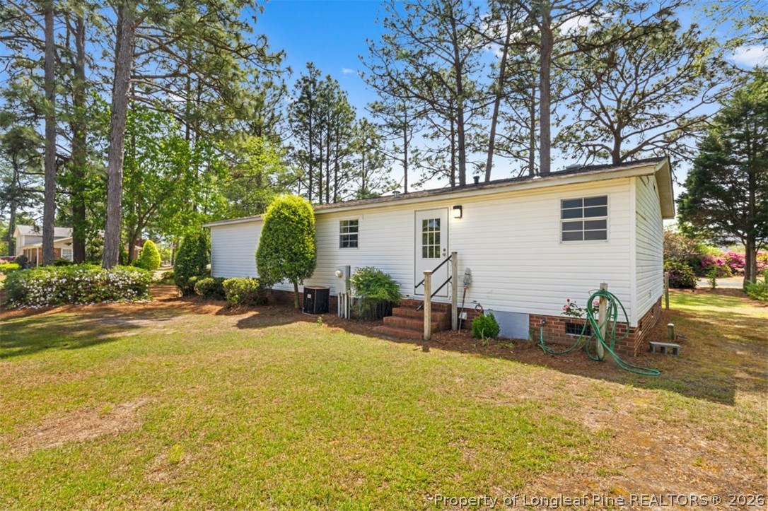 310 Canady Street Fayetteville, NC 28306 - Photo 39 of 50 a view of a house with backyard and sitting area
