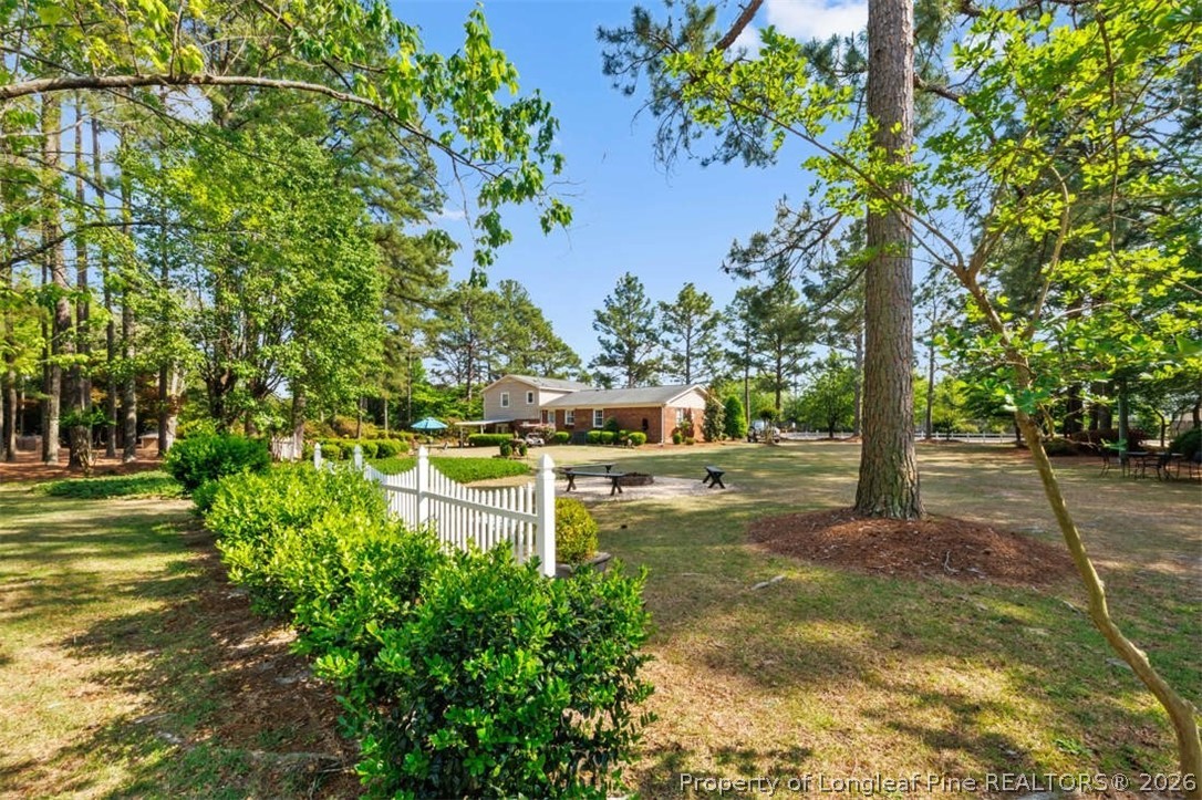 310 Canady Street Fayetteville, NC 28306 - Photo 49 of 50 a backyard of a house with lots of green space