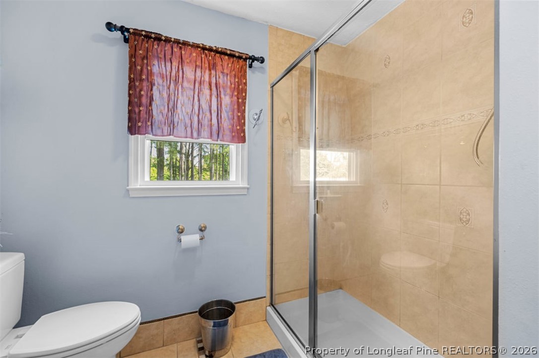 310 Canady Street Fayetteville, NC 28306 - Photo 6 of 50 a bathroom with a toilet and a shower