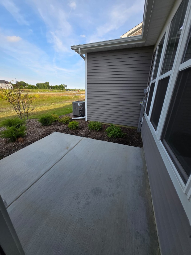 668 Switchgrass Way, Unit 58004 Bolingbrook, IL 60490 - Photo 29 of 31 a view of a terrace with a lake view