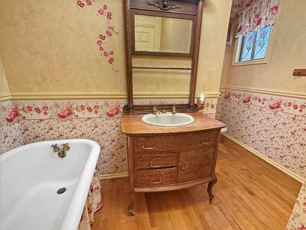 a bathroom with a sink and a mirror