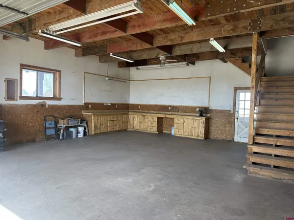 a view of empty room with a fireplace